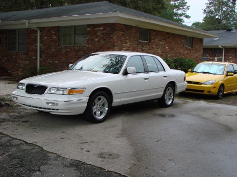 1997 Mercury Grand Marquis - Front 3/4 view with new wheels. Focus trying to get in on the act.