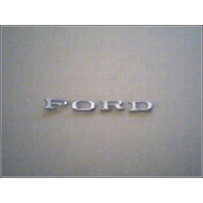 1973 Ford Ranchero - A chrome Ford emblem is shown against a neutral background. The registry claims it is from a 1973 Ford Ranchero.