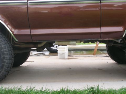 1979 Ford Bronco - Undercarriage view of a 1979 Ford Bronco, focusing on the exhaust system and suspension.