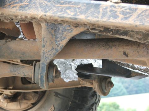 1996 Ford Bronco - Undercarriage view with foil insulation applied to some components.