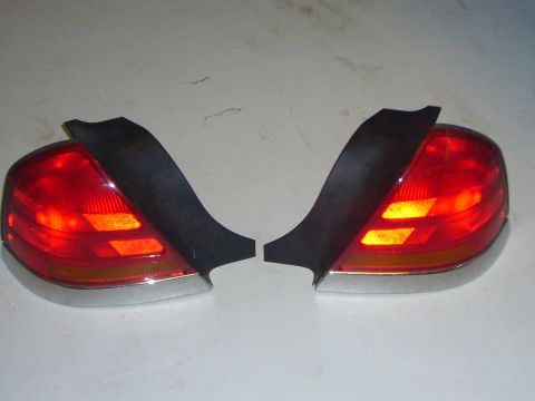 2000 Ford Crown Victoria - Two taillights are displayed against a neutral background.