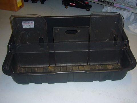 2000 Ford Crown Victoria - This black police trunk organizer features clear dividers and a label indicating it is a "POLICE TRUNK PACK".