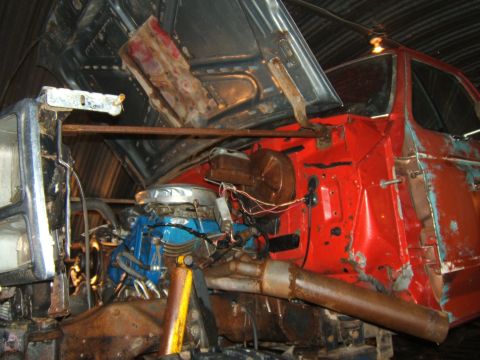 1980 Ford F-250 - The engine bay of a truck is exposed with the hood up, revealing the engine and surrounding components.