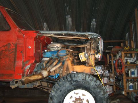 1980 Ford F-250 - Front view of a 1980 Ford F-250 undergoing modifications, with the engine and front suspension visible.