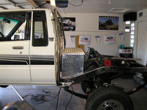 1986 Toyota Hilux - Side view of a 1986 Toyota Hilux cab and chassis undergoing modification.