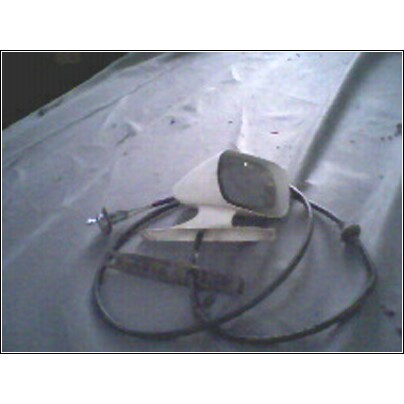 1973 Ford Ranchero - Side mirror assembly with attached cable, likely for an older vehicle.