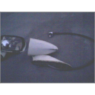 1973 Ford Ranchero - A car mirror and fender part are shown against a dark background.