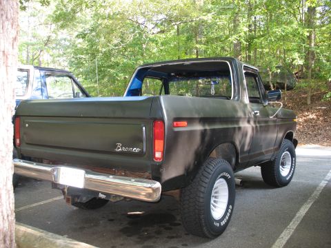1995 Ford C-350 (Centurion Conversions) - This Ford Bronco, likely from the late 1970s, is seen parked outdoors next to another vehicle.