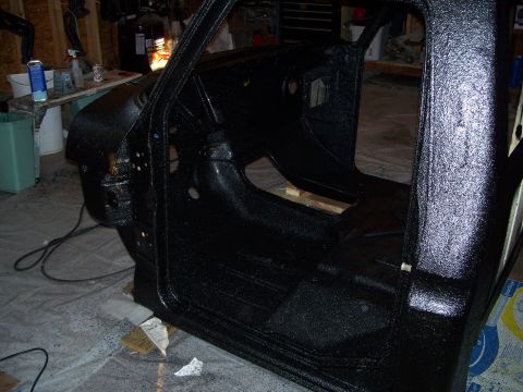 1979 Ford F-150 - The interior of a 1979 Ford F-150 cab has been coated with a black protective material.