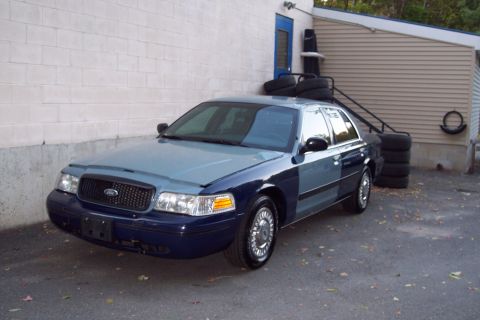 2001 Ford Crown Victoria - This 2001 Ford Crown Victoria sedan is shown in a two-tone blue and gray paint scheme.