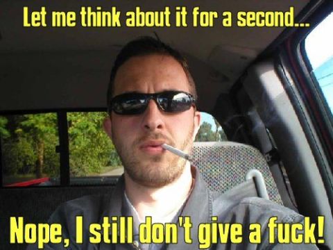 1992 Ford Mustang - A man sits in a car, smoking a cigarette and looking at the camera.
