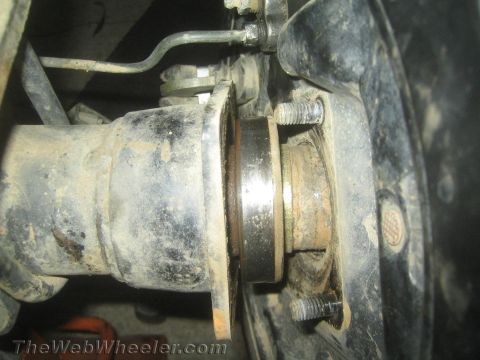 1987 Suzuki Samurai - The rear axle assembly shows significant wear and a broken axle shaft, indicating a mechanical failure.