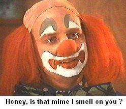 2000 Ford Crown Victoria - A clown's face is shown with dramatic makeup and a wig, with text overlay at the bottom.