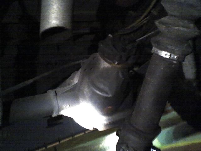 Close-up of a vehicle's differential and driveshaft components
