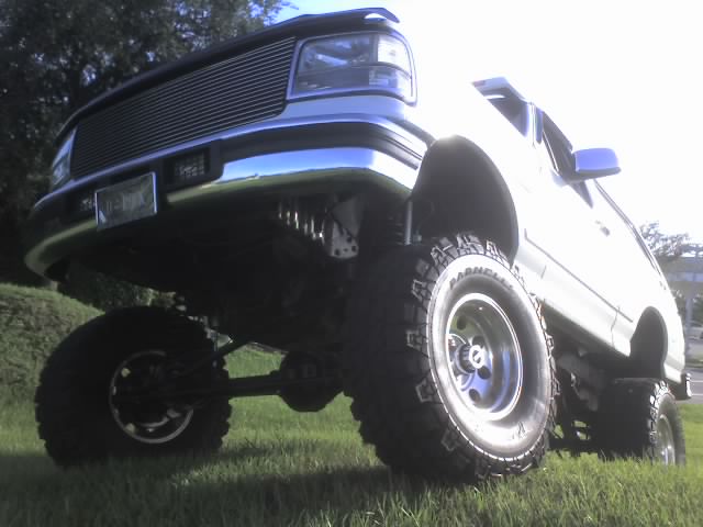 1995 Ford Bronco with lifted suspension and large off-road tires