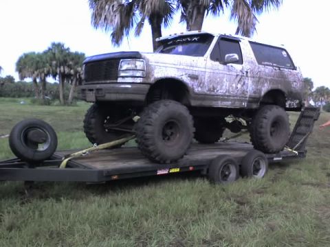 1995 Ford Bronco - This lifted 1995 Ford Bronco is loaded onto a trailer, ready for transport.