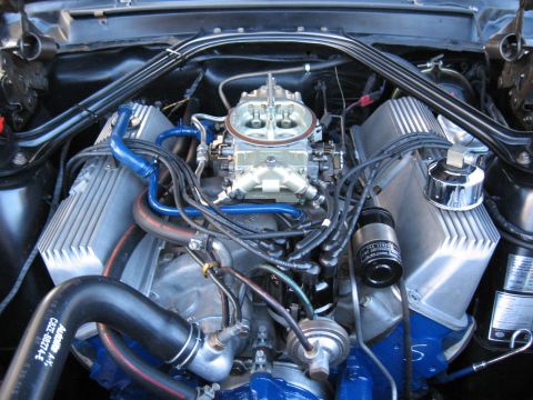 1968 Shelby GT500 - Engine bay details with a prominent carburetor and ribbed valve covers.