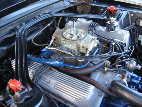 1968 Shelby GT500 - Detailed view of the engine compartment, highlighting the carburetor and ribbed valve covers.