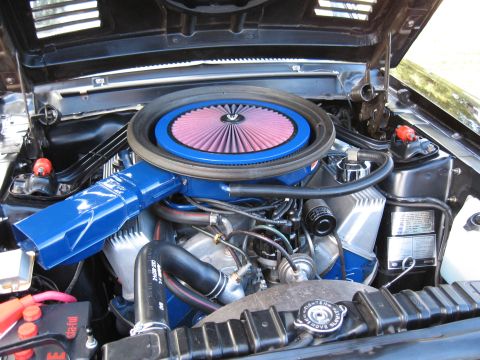 1968 Shelby GT500 - Close-up of a car's engine bay, highlighting the air intake system and engine components.