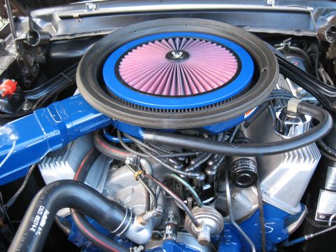 1968 Shelby GT500 - Close-up of a vehicle's engine bay, focusing on the air intake system and engine components.