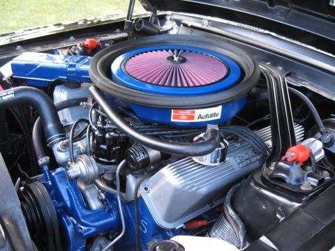 1968 Shelby GT500 - The engine bay features a prominent air filter assembly and detailed valve covers, suggesting a performance-oriented V8.