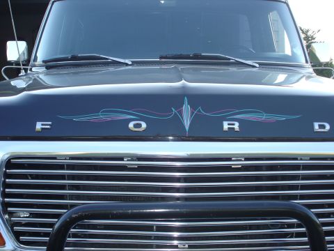 1979 Ford F-250 - Front view of a dark blue 1979 Ford F-250 truck with chrome grille and hood pinstriping.