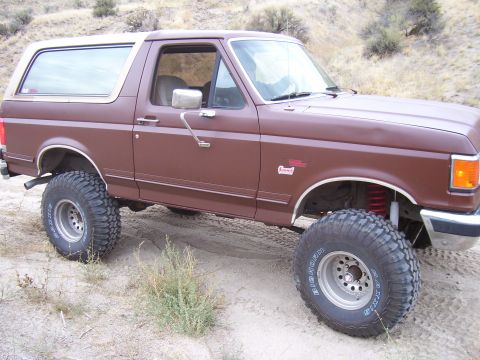 1990 Ford Bronco - Modified 1990 Ford Bronco off-road vehicle with aftermarket suspension and wheels.