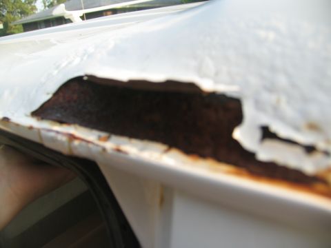 1995 Ford C-350 (Centurion Conversions) - Significant rust damage is visible along the roof edge of this vehicle.