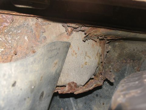 1995 Ford C-350 (Centurion Conversions) - Severe rust damage is visible on the undercarriage of the vehicle, affecting structural integrity.