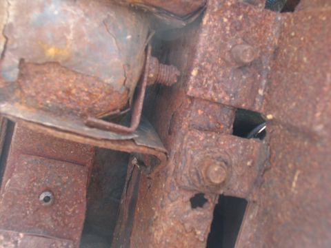 1995 Ford C-350 (Centurion Conversions) - The undercarriage shows significant rust and corrosion on structural components.
