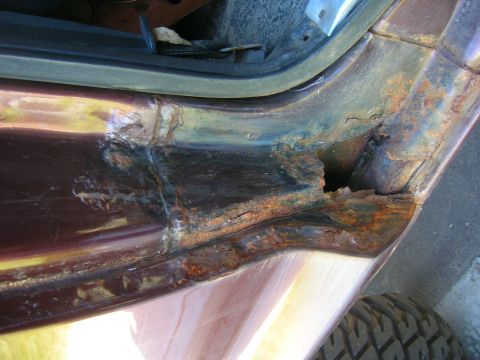 1979 Ford Bronco - Significant rust has eaten through the door sill of this vehicle, revealing extensive corrosion.