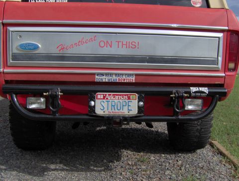 1978 Ford Bronco - Rear view of a red 1978 Ford Bronco, a custom bumper and a personalized Arkansas license plate.