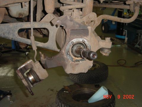 1986 Ford Bronco - Picture of the bad caliper. You can see the cup sticking way out.