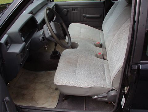 1993 Mitsubishi FTO - Interior view of a car showing the seats, dashboard, and steering wheel.