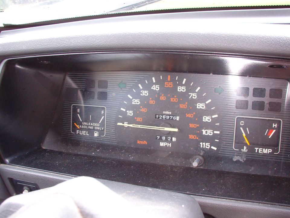 Dashboard gauges with fuel and temperature indicators, odometer shows 126976 miles