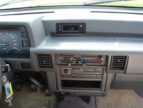 1993 Mitsubishi FTO - Interior view of a car's dashboard, showing the instrument cluster, radio, and climate controls.