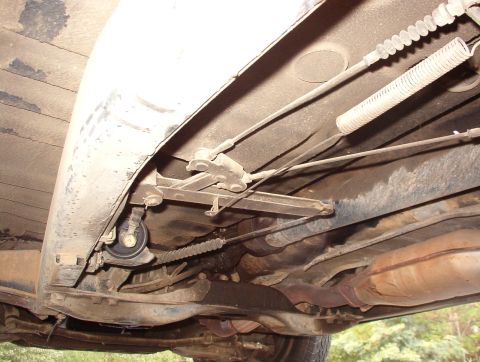 1993 Mitsubishi FTO - Underside view of a vehicle's mechanical components, including suspension and exhaust system.