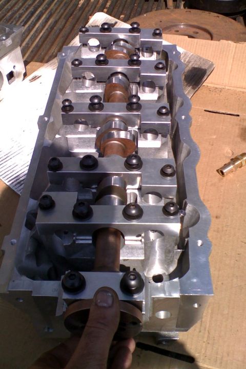 1964 Ford 427 - Close-up of an engine cylinder head assembly, showing internal components like camshafts and rocker arms.