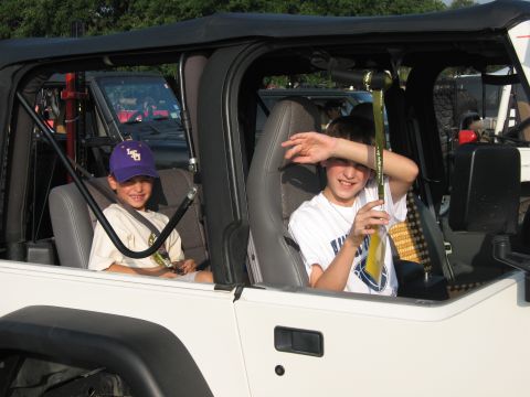 2001 Jeep Wrangler - Two boys are inside a white Jeep Wrangler, with another Jeep visible behind them.
