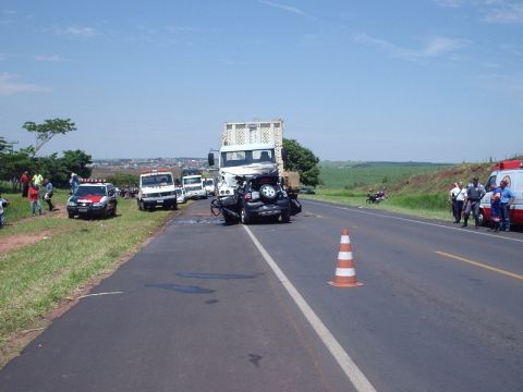 1987 Ford Thunderbird - Emergency responders at a multi-vehicle accident scene on a highway.