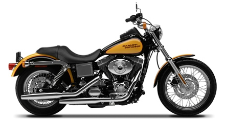 1998 Ford Crown Victoria - Side view of a yellow and black Harley-Davidson motorcycle with chrome accents.
