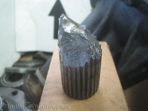 1987 Suzuki Samurai - Close-up of a broken axle shaft, showing the splined end and the fractured metal.