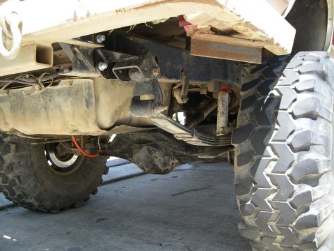 1995 Ford Bronco - The rear suspension and drivetrain components of a modified off-road vehicle are visible in this close-up shot.