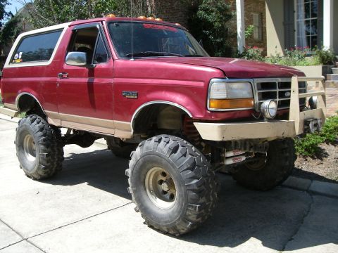 1995 Ford Bronco - This lifted 1995 Ford Bronco features a custom brush guard and oversized off-road tires.