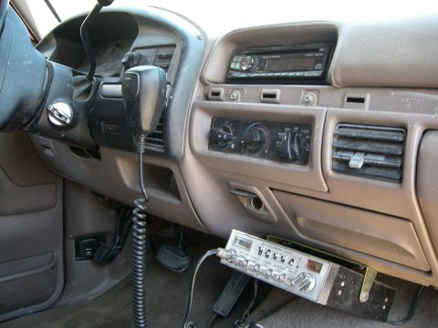 1995 Ford Bronco - Interior view of a 1995 Ford Bronco, a CB radio and aftermarket stereo system.