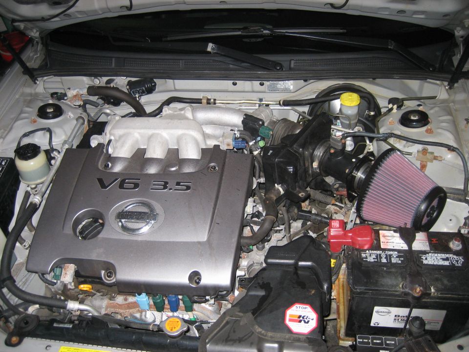 Nissan V6 3.5 engine bay with aftermarket air filter. Matches 2002 Nissan Maxima