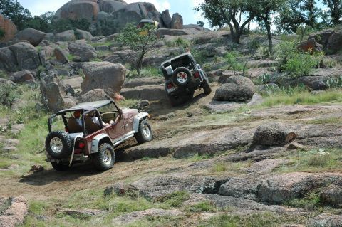 2001 Jeep Wrangler - Two Jeep Wranglers navigate a challenging rocky off-road course.