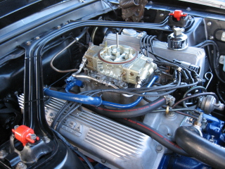1968 Shelby GT500 - Close-up view of the engine compartment of a 1968 Shelby GT500, highlighting its V8 engine components.