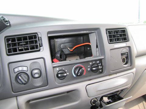 1991 Ford LTD Crown Victoria - The dashboard shows an open slot where a radio might have been, along with climate controls and vents.