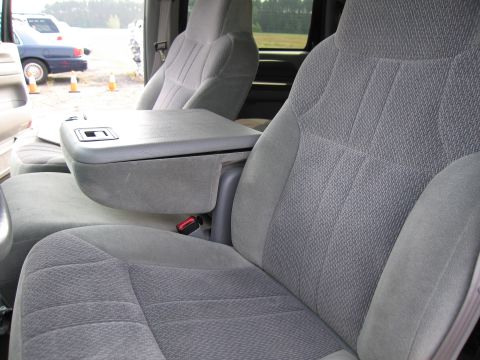 1991 Ford LTD Crown Victoria - Interior view of gray fabric front seats and center console, with another vehicle visible outside.
